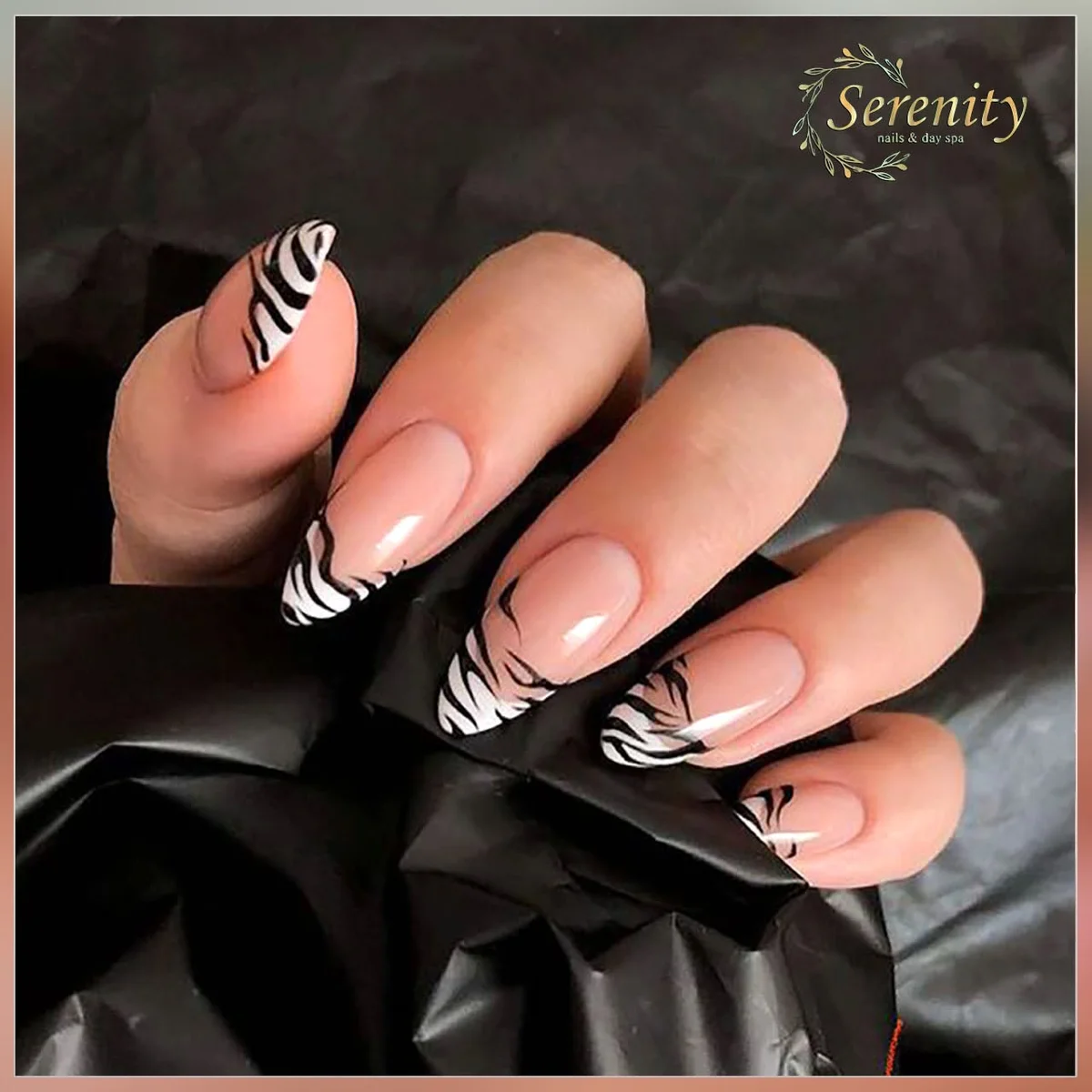 Pink French nails with black zebra designs