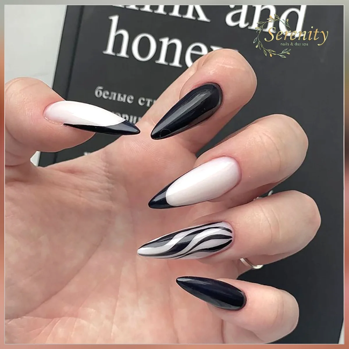 Black and white pointed nails with zebra accents